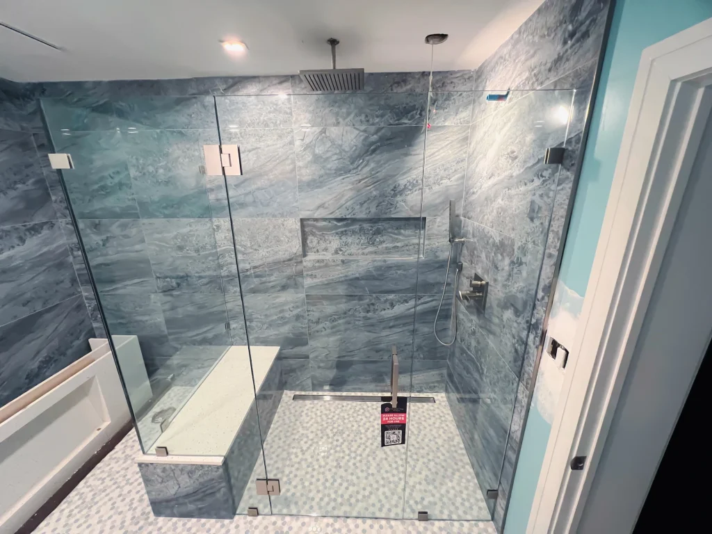 High-quality custom glass shower door with sleek design and durable hardware.