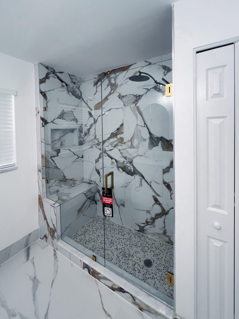 High-end marble shower glass enclosure with durable frameless design.