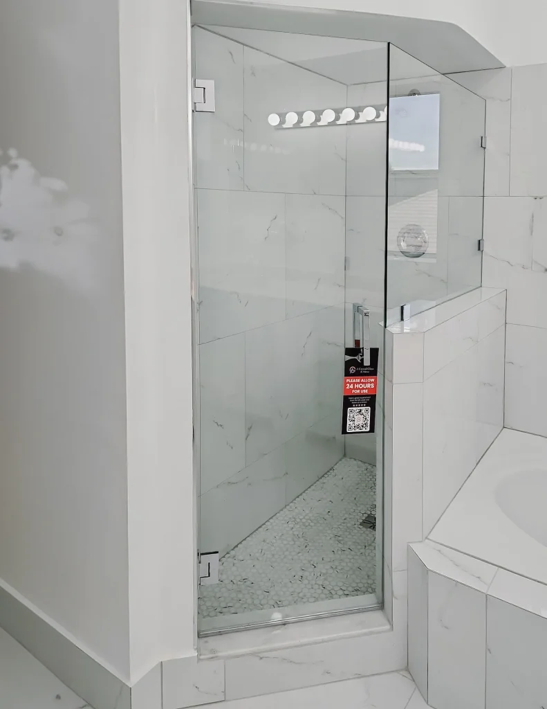 Sharp, clear glass shower enclosure for modern bathrooms.
