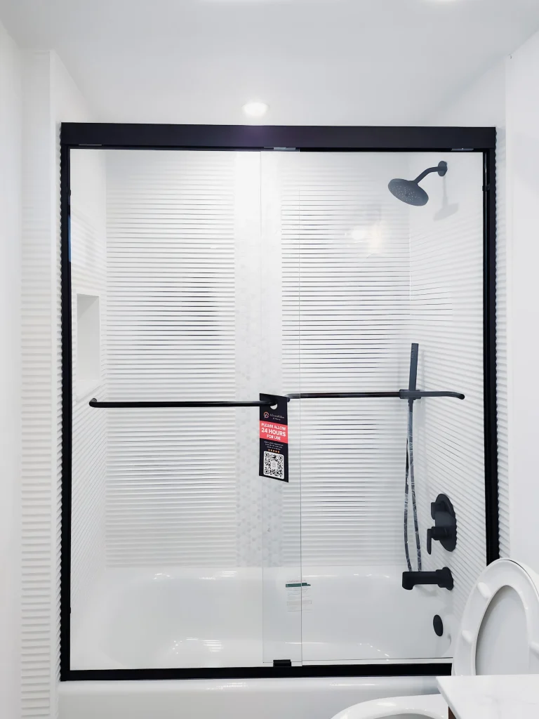 High-quality glass shower enclosure for modern bathrooms. Custom mirrors and glass solutions by ACG Glass & Metals.