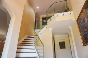 Staircase with glass railing for modern home interior design.