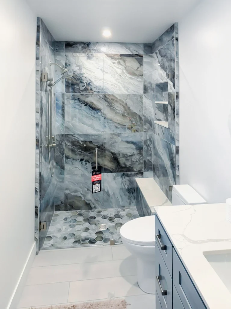 Enhanced marble shower glass wall for modern bathroom design.