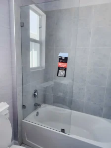 High-quality glass shower door with seamless installation in modern bathroom.