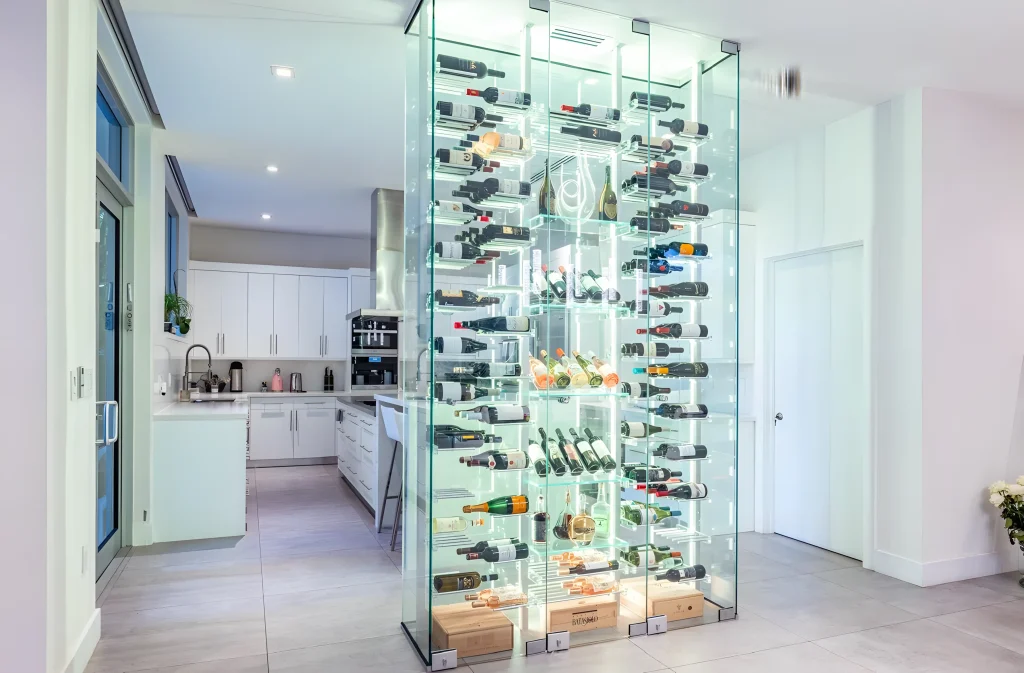 Stunning glass wine cabinet with LED lighting for storing and showcasing wine bottles elegantly.
