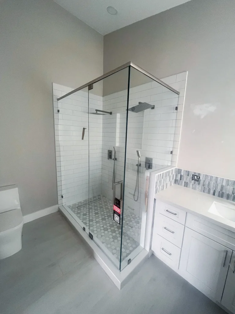 High-quality glass shower door with modern hardware, perfect for luxury bathroom upgrade.