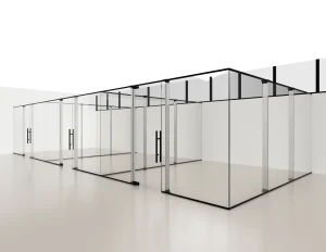 Modern glass wall partition for office or commercial spaces with sleek metal framing.