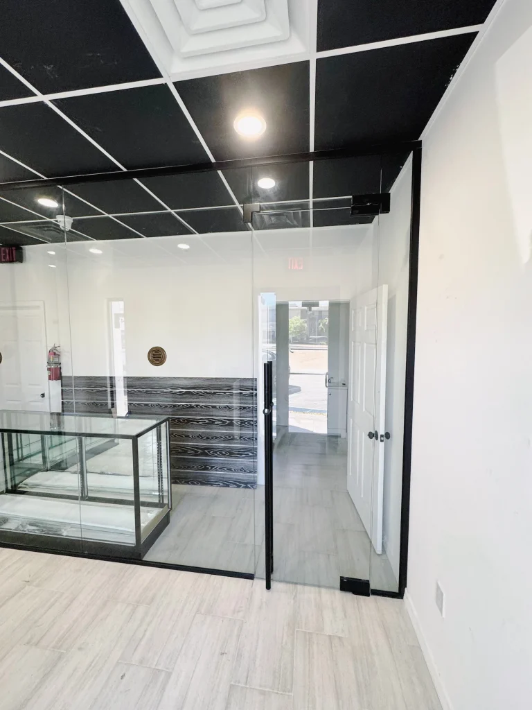 High-quality glass partition with sleek black framing in modern commercial space.