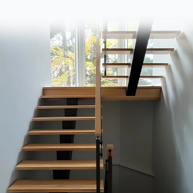 The Seattle stairs combine steel integrity with invisible craftsmanship. Built around a central spine, each step is engineered for silent impact.
