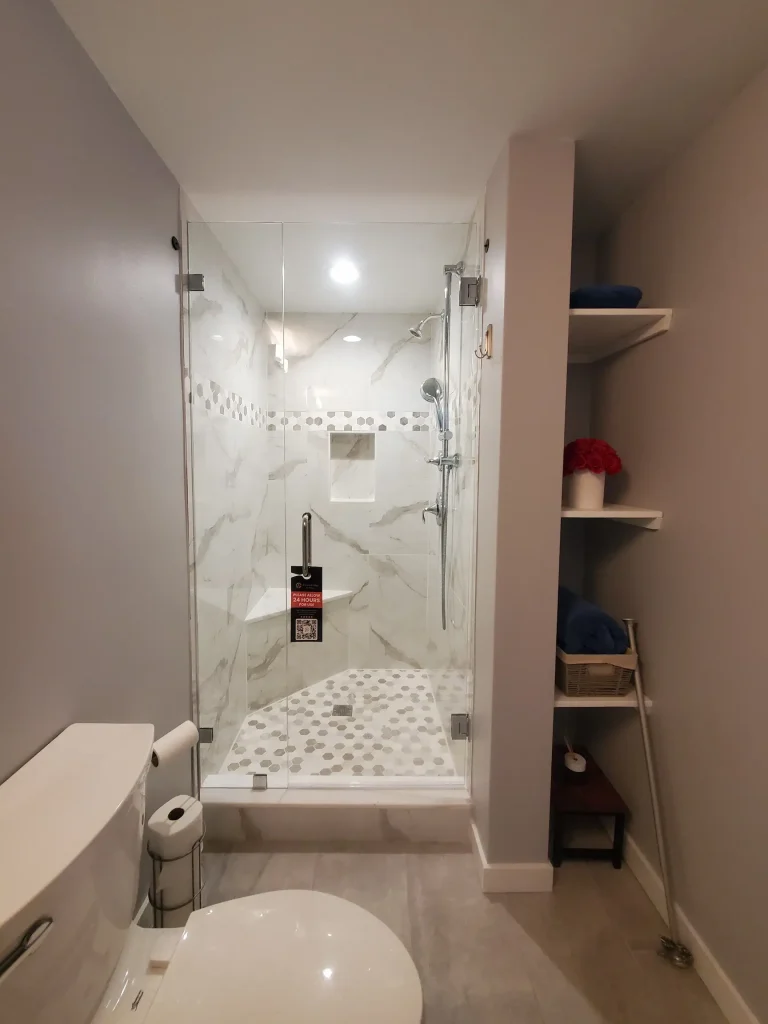 Meticulous mirror and glass shower.