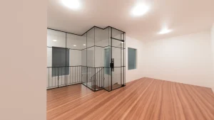 Staircase glass enclosure with black metal framing enhancing contemporary interior design.