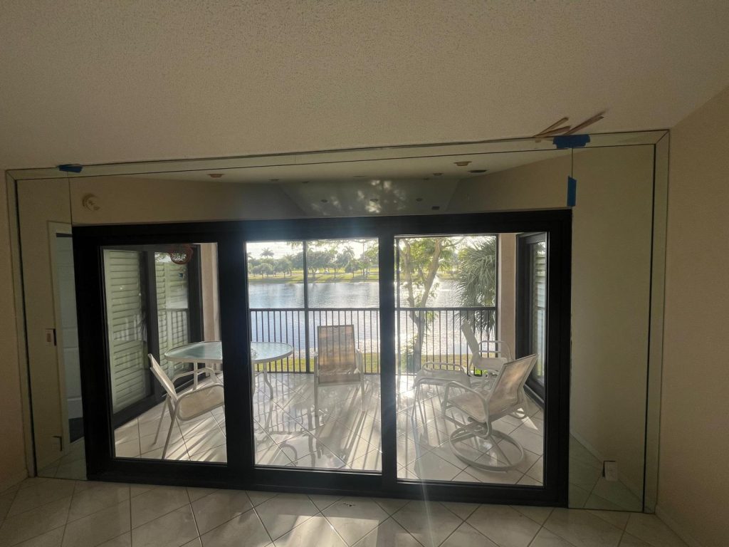 Mirror wall enhances space and light, adding a modern touch to the room.