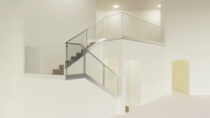 Modern glass and mirror staircase railing for stylish interior design.