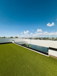 Clear glass balcony railing for modern home aesthetics.