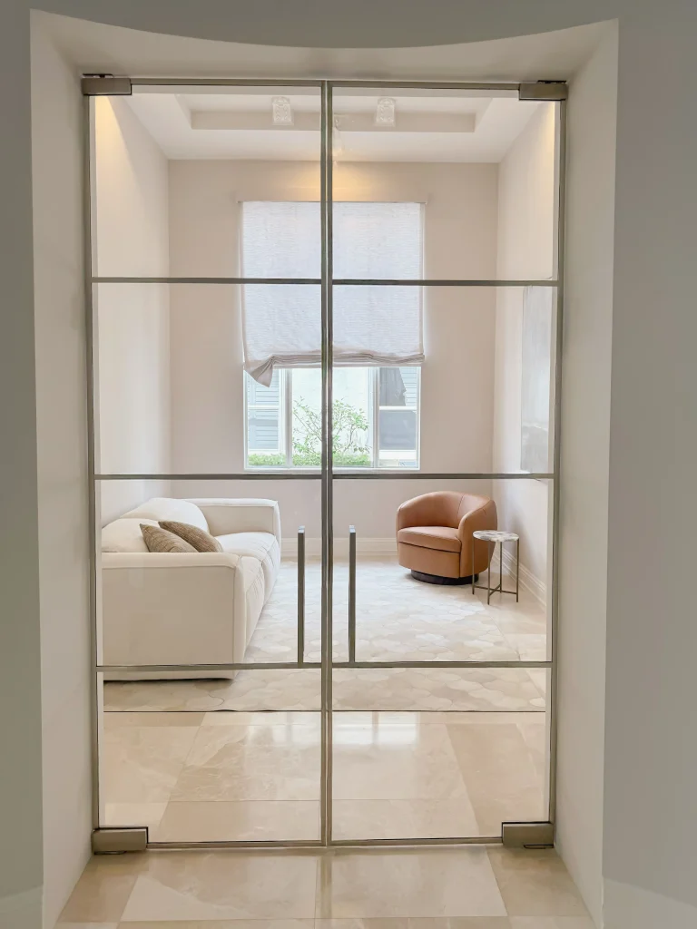Clear glass door with metal frame for home or office.