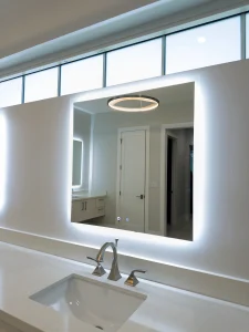 Highly reflective mirror with LED backlighting, perfect for bathroom vanity or bedroom decor.