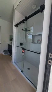 High-quality glass shower enclosure with black hardware for modern bathrooms.