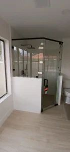 Premium glass shower enclosure with black accents and sleek modern look.