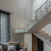 Alt text: Elegant glass railing staircase with metal fittings in contemporary living space, minimalist style.