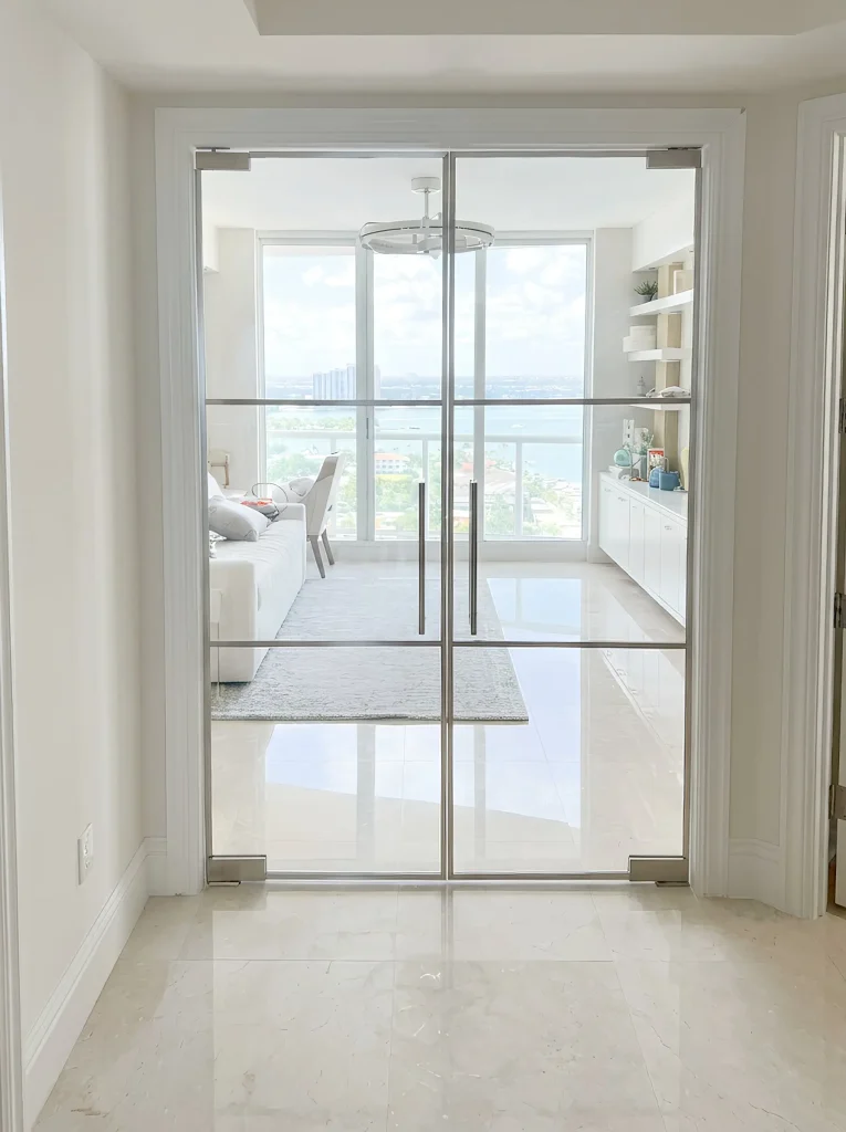 Smooth glass sliding door with mirror for stylish interior design.