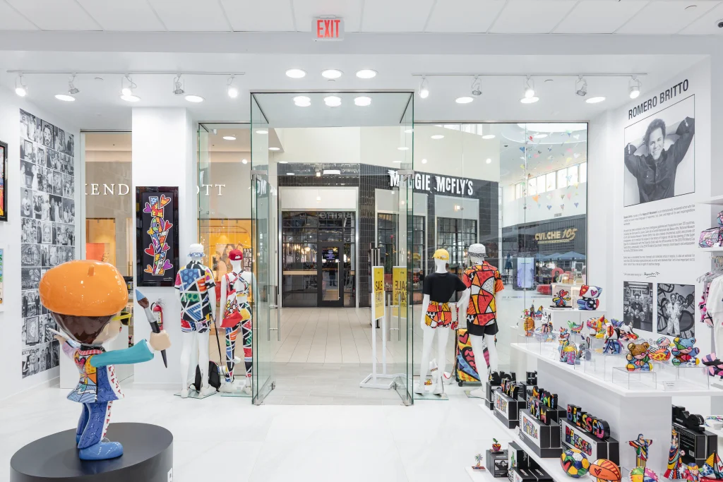Elegant display of colorful crystal glass and mirror art in modern retail store.