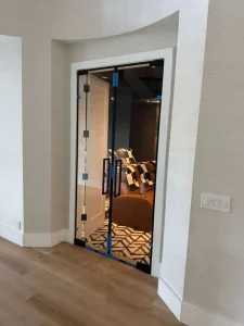 Elegant glass and mirror door with black frame and handle.