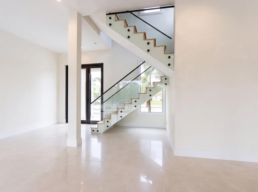 Full view of the interior glass railing system at the Rodeo Drive residence in Wellington FL