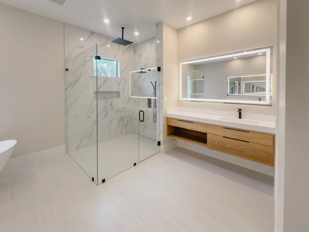 Frameless shower enclosure and floating vanity in the master bathroom of a Wellington FL home