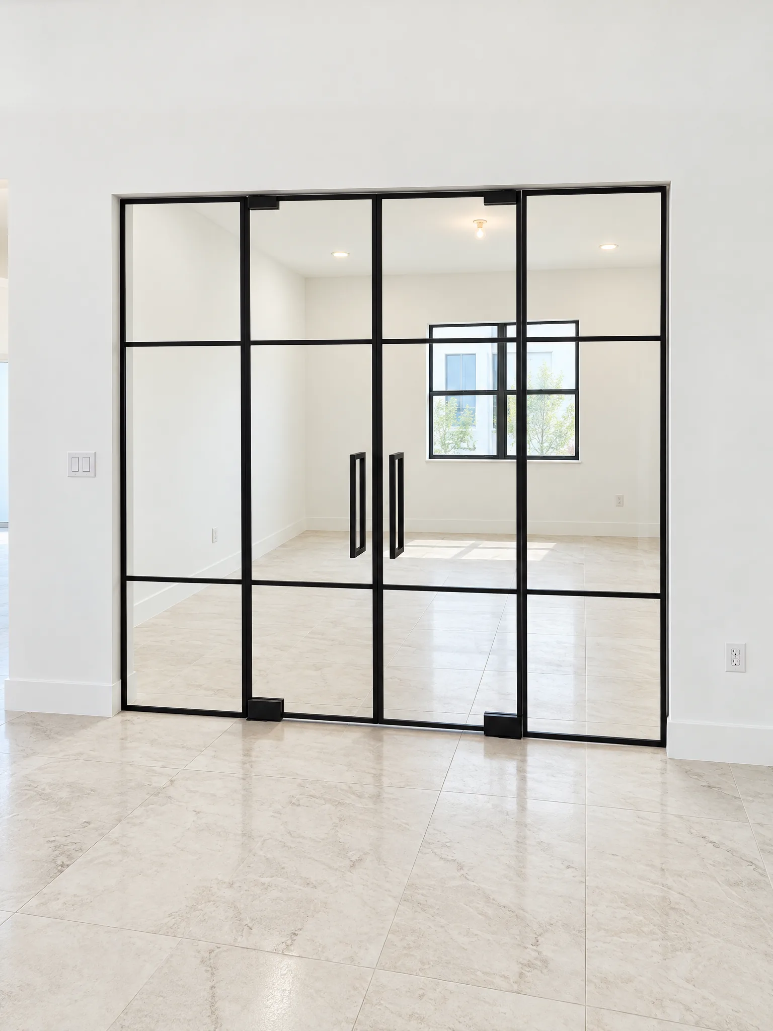 Black aluminum grid glass partition with double doors