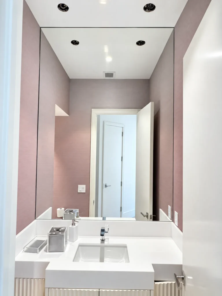 Floor-to-ceiling vanity mirror in a powder room, Monte Carlo Drive residence