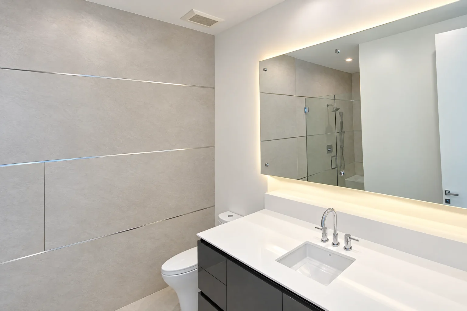Floating mirror installed by ACG Glass & Metals