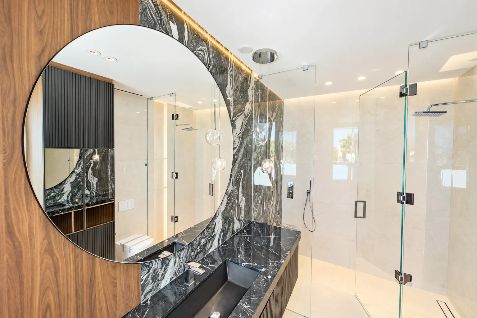 Round mirror installed by ACG Glass & Metals