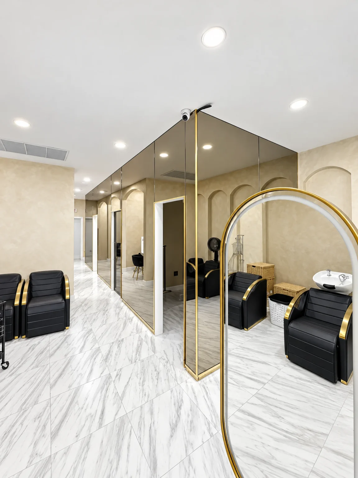 Bronze mirror wall with gold trim at Darma Hair Salon, West Palm Beach