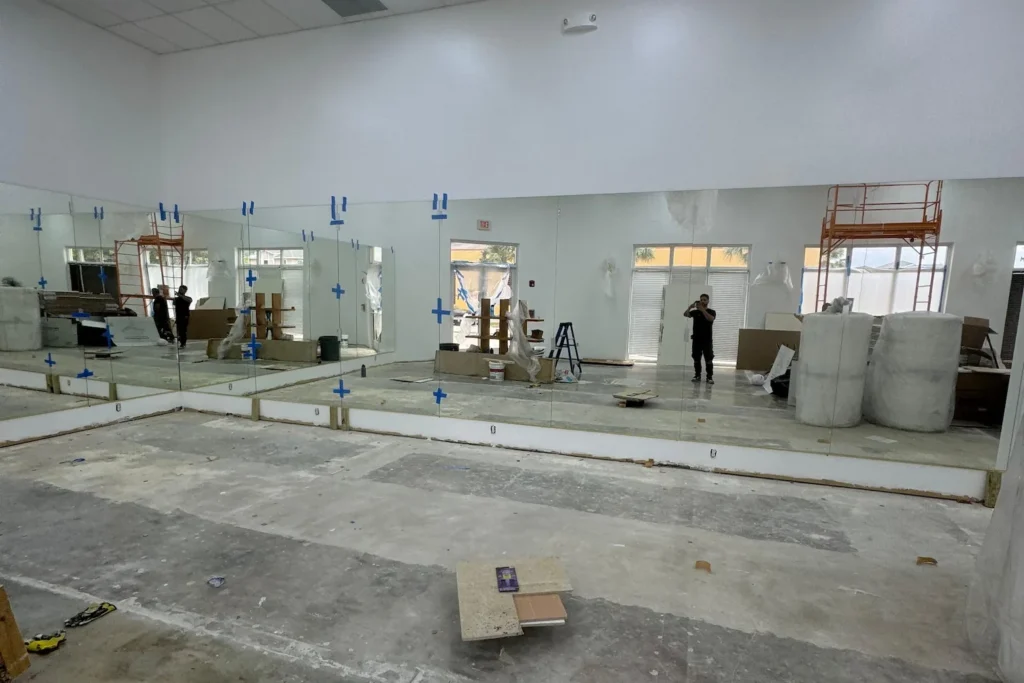 Full wall mirror installation in a dance studio in West Palm Beach by ACG Glass & Metals