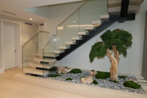 Floating staircase with white oak treads, black steel stringer and glass railing, Hamaca Court residence, Boca Raton, FL