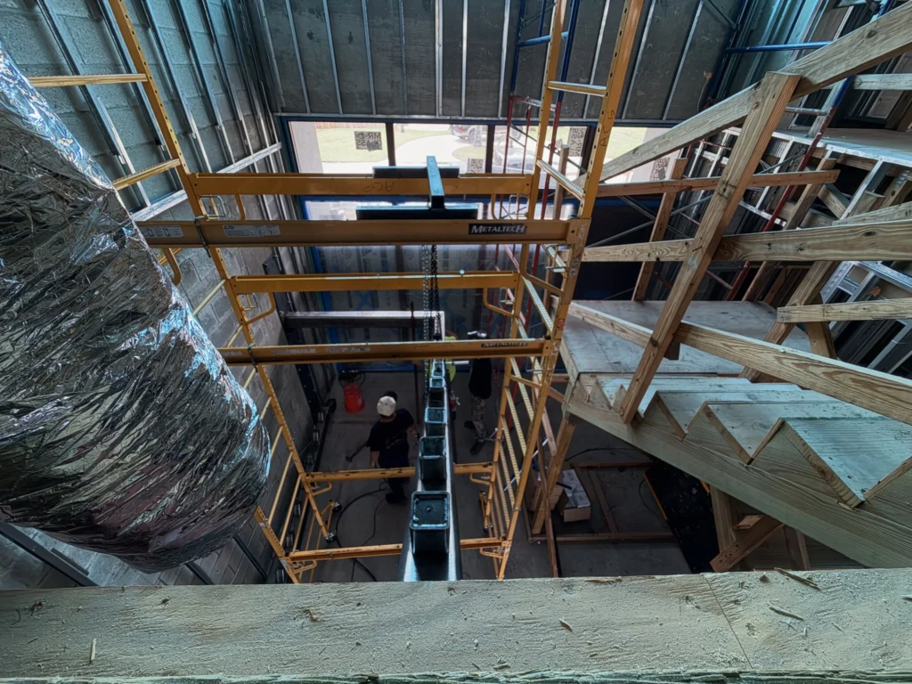 Steel center spine stringer of a floating staircase being installed, SW 4th Ave residence, Boca Raton, FL
