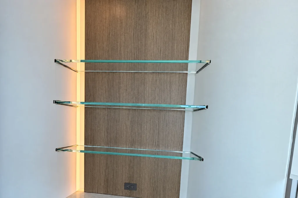 Low iron glass shelves in a recessed U channel at a West Palm Beach condominium bar by ACG Glass & Metals