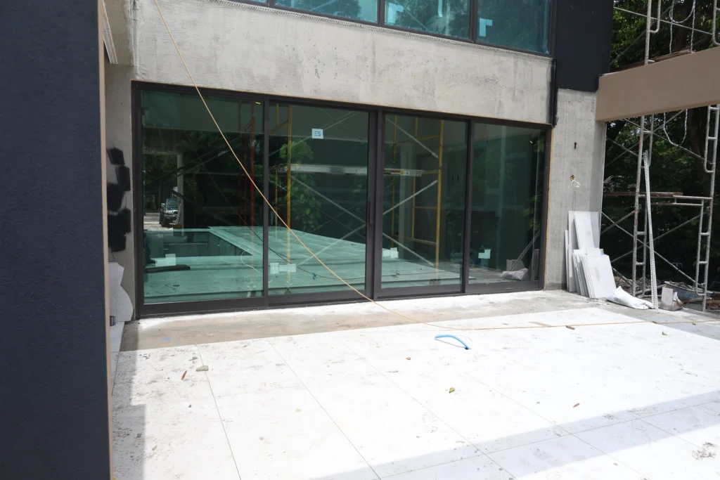 Bronze impact windows and doors by ACG Glass & Metals at a modern Boca Raton home