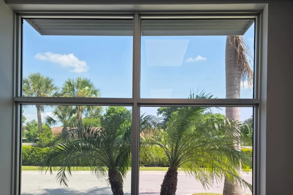 Replacement storefront window glass with Solarban 70 at an office on North Haverhill Road, West Palm Beach, FL