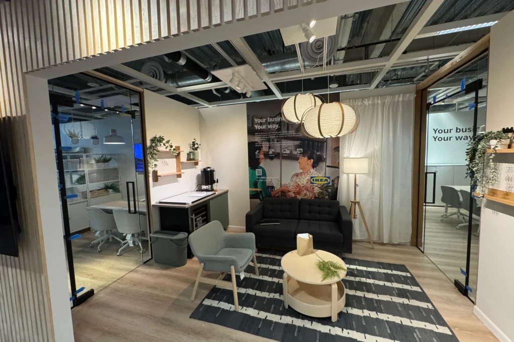 Frameless interior glass partitions with matte black hardware at IKEA Sunrise, Florida