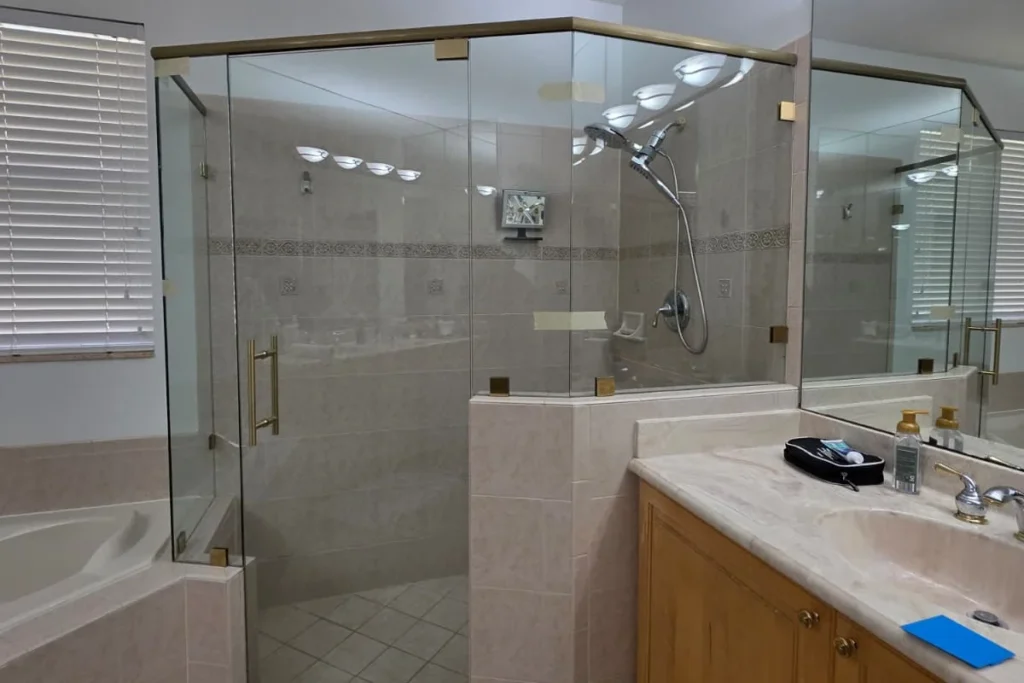 Frameless glass shower enclosure, Las Brisas Circle residence, Hypoluxo