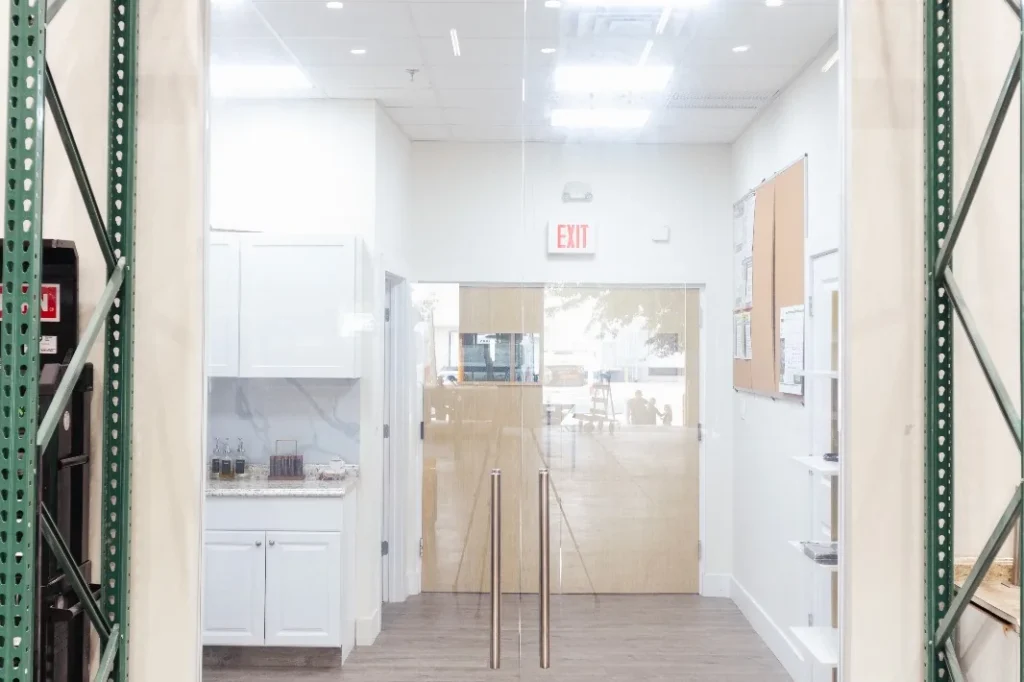 Frameless glass swing doors at an office entrance in Riviera Beach