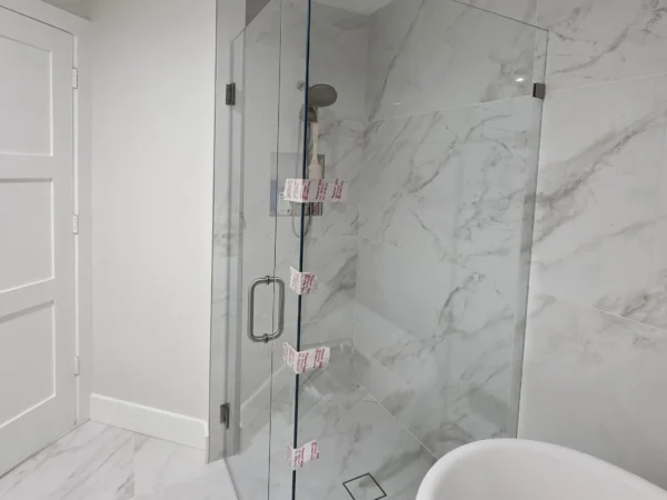Shower Enclosure and Glass Shelves | Saint Tropez Circle Residence, West Palm Beach