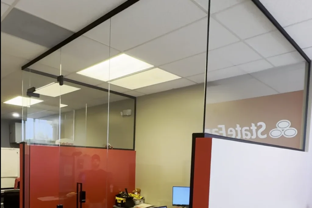 Frameless glass office partition at a State Farm office in Boynton Beach by ACG Glass & Metals