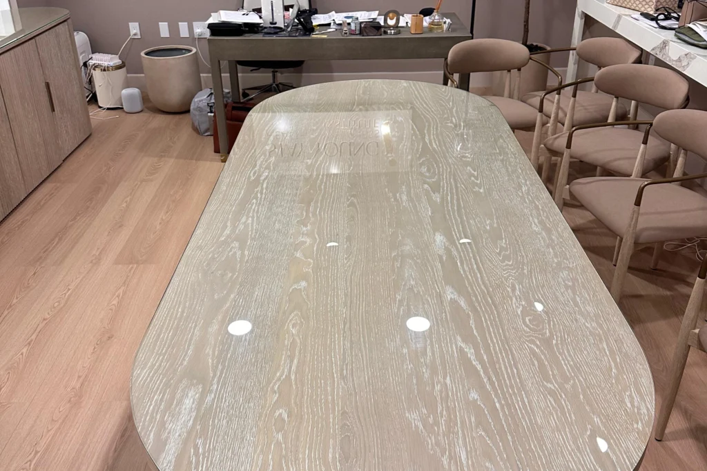 Custom shaped clear tempered glass table tops at a medical wellness office in West Palm Beach, FL
