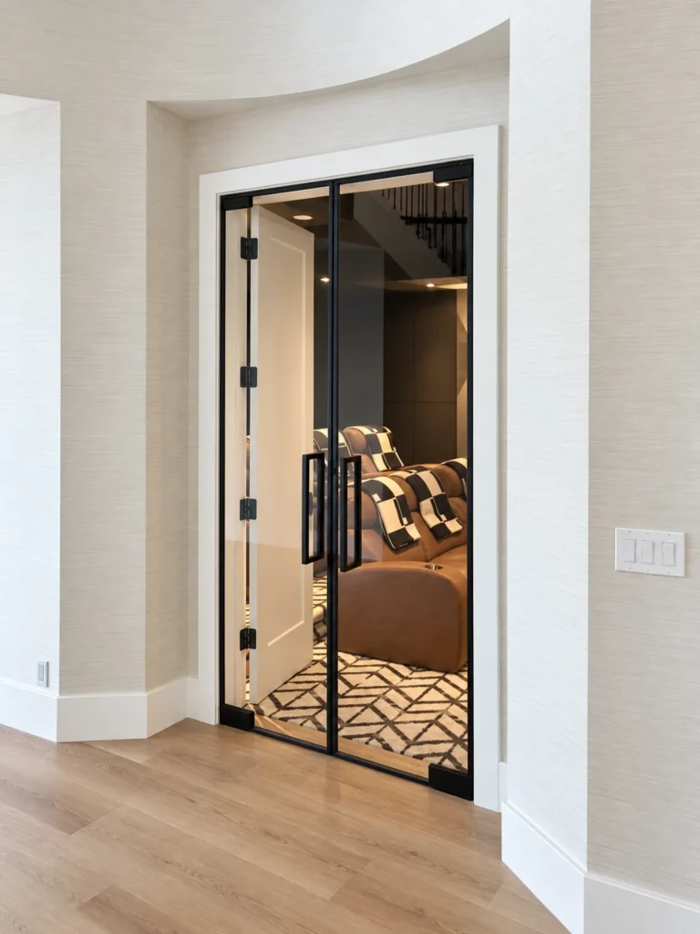 Black framed glass double doors with a center grid, Valhalla Drive residence
